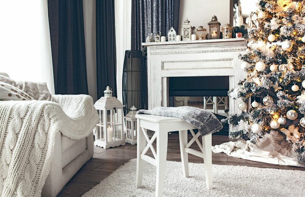 living room with fireplace and sofa. Lots of whites with Christmas decorations all around