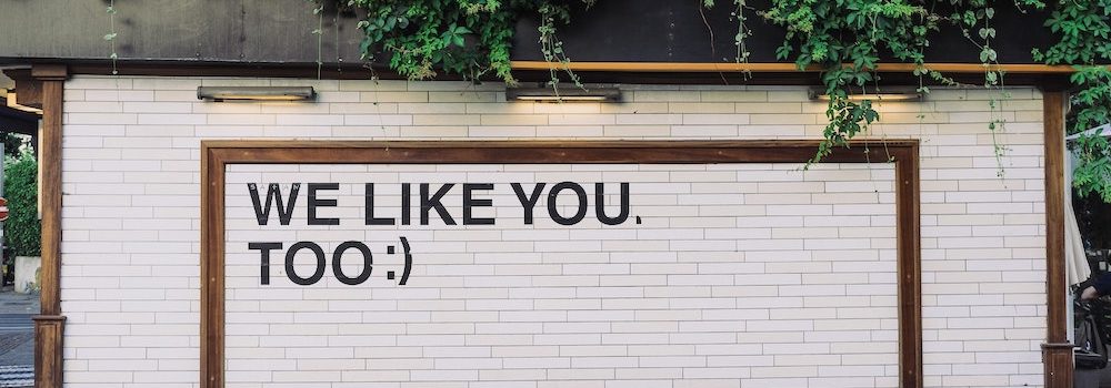 wall with the message on it, "WE LIKE YOU, TOO :)"
