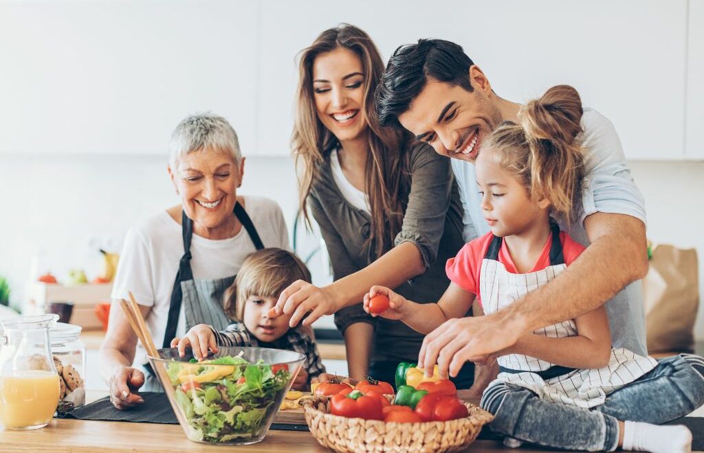 multi-generational family having fun together in their kitchen