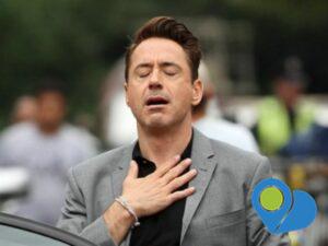 This is the meme we've all seen of Robert Downey, Jr. looking relieved with his eyes closed and his hand "clutching his pearls."
